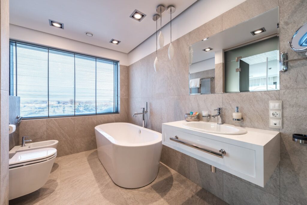 Modern bathroom with new plumbing installations, representing professional plumbing services