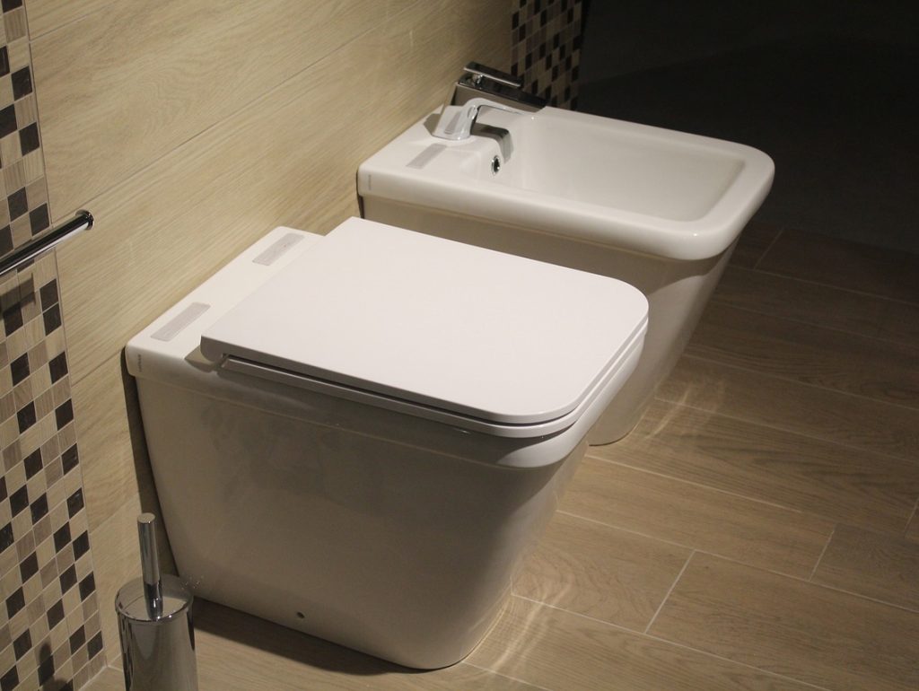 Modern bathroom with toilet, representing leaking toilet repair service.