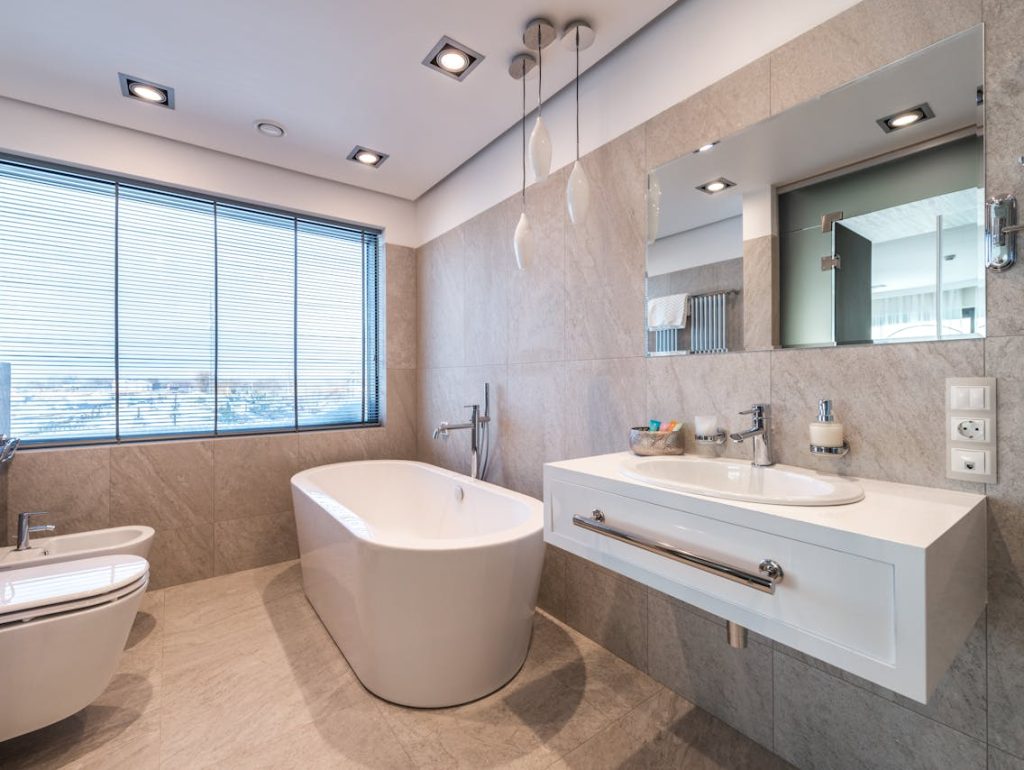 Modern bathroom with new plumbing installations, representing professional plumbing services